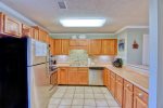 Kitchen is extra large with lots of counter space and cabinets.